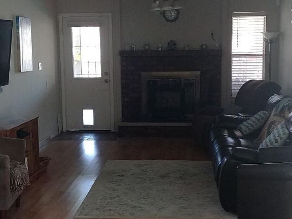 A small doggy door on back door and large doggy door on side