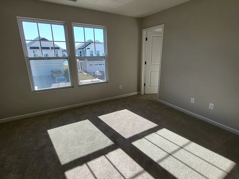 One of three secondary bedrooms with walk-in closet