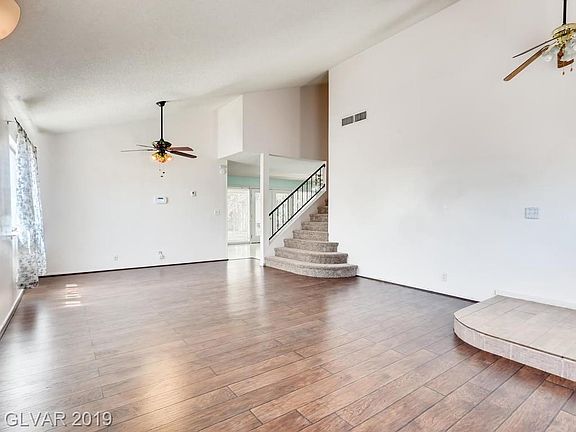 Vaulted ceilings, laminate floors, front formal living and dining room