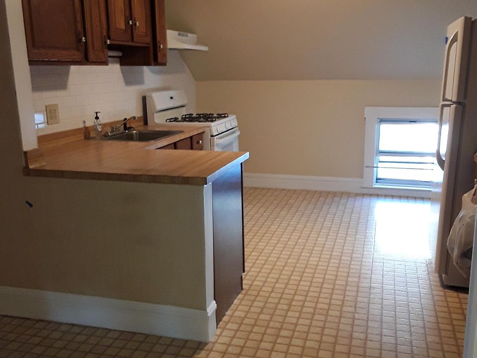 Large eat-in kitchen with huge pantry. New subway tile backsplash and newly painted.