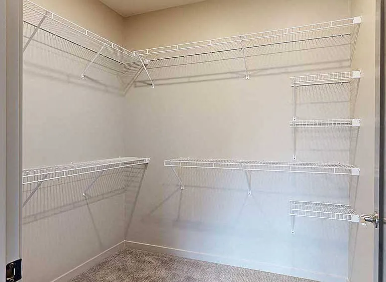 Stay effortlessly organized with this expansive walk-in closet, offering plenty of shelving and storage space.