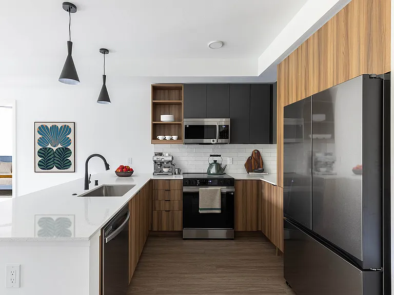 Modern kitchen with warm finish package and quartz countertops