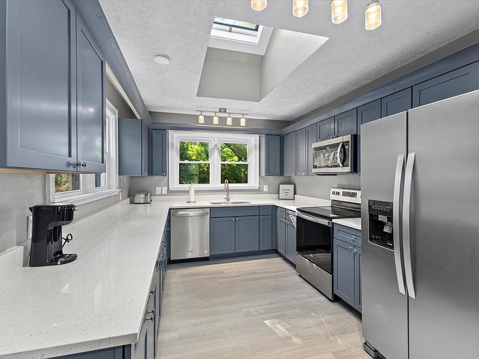 Light, Bright Kitchen with Spacious Corian Counter tops, Stainless Steel Appliances, pots and pans, silverware and individually assigned cabinet space, for private storage needs.