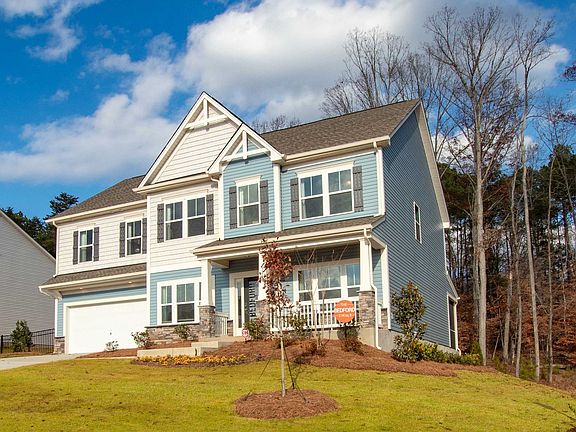 a blue and white house with a lot of windows