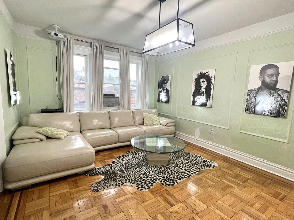 Included: Leather L shaped Couch, Neon Sign Photography installation, coffee table, TV Console, Rug, Large AC window unit (cools up all front rooms well), Curtains and curtain rod 

Not Included: N/A (everything shown included)