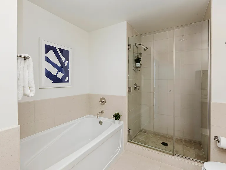 En-suite bathroom in Primary room with separate bathtub and shower
