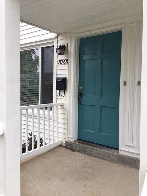 A pop of color accents the door