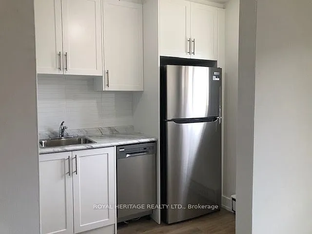 Building Photo - 945 Simcoe St N #103