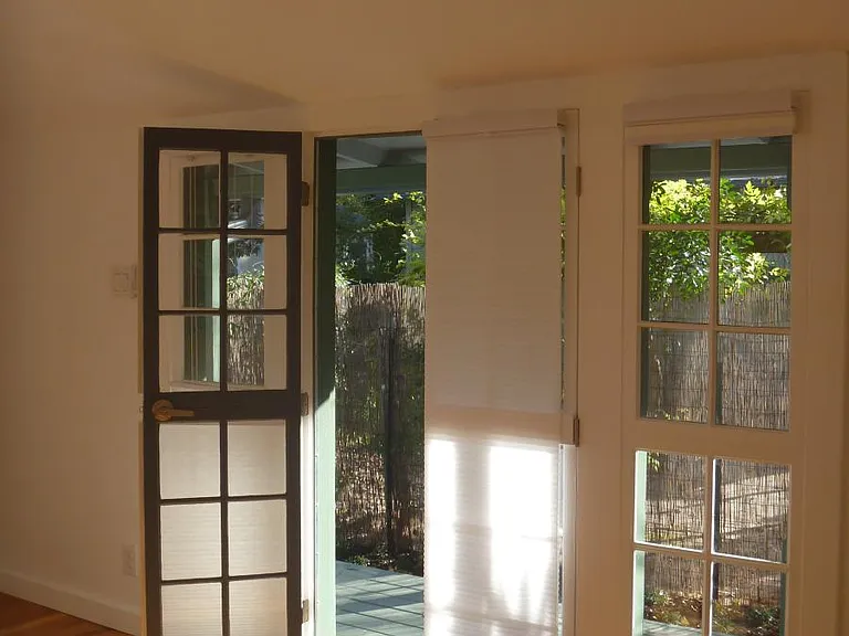 Studio south wall and doors and cellular shades