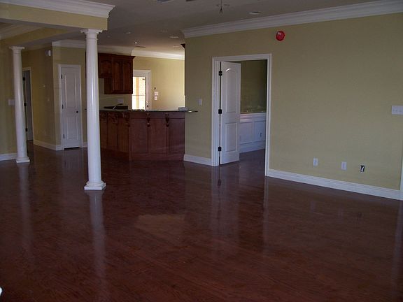 Living, dining, and kitchen continuous.