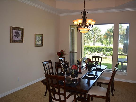 Spacious dining room with a patio lakeview.