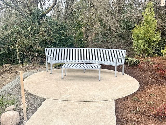 The walkway through the central courtyard ends at this welcoming bench