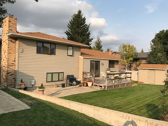 Back of home with deck