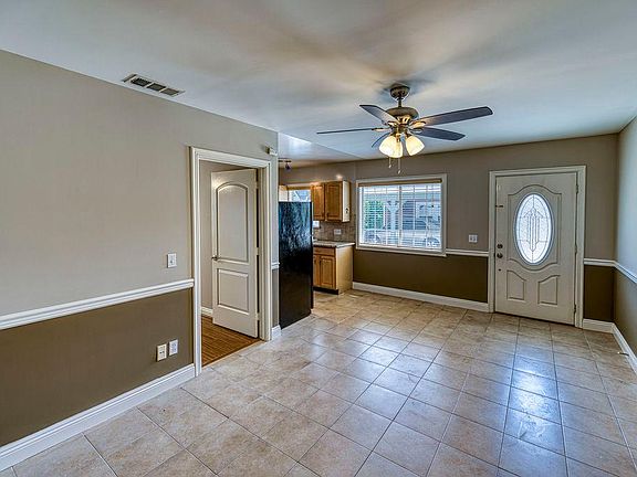 View of living room, front entry on the RT side
