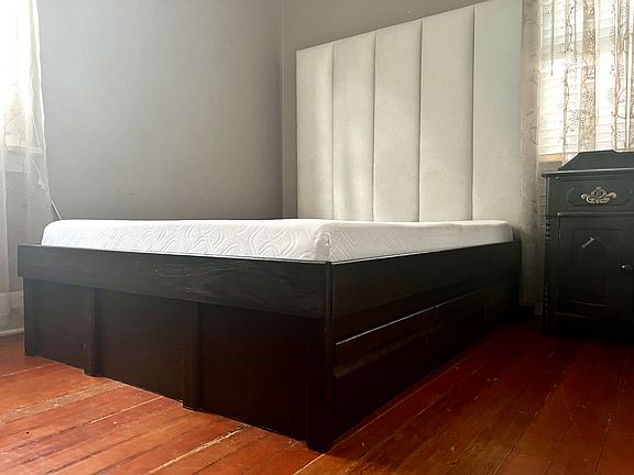Private Bedroom available with full-size platform bed with foam mattress + 6 drawers (or unfurnished, if preferred. 2 windows. AC unit. Side dresser.
