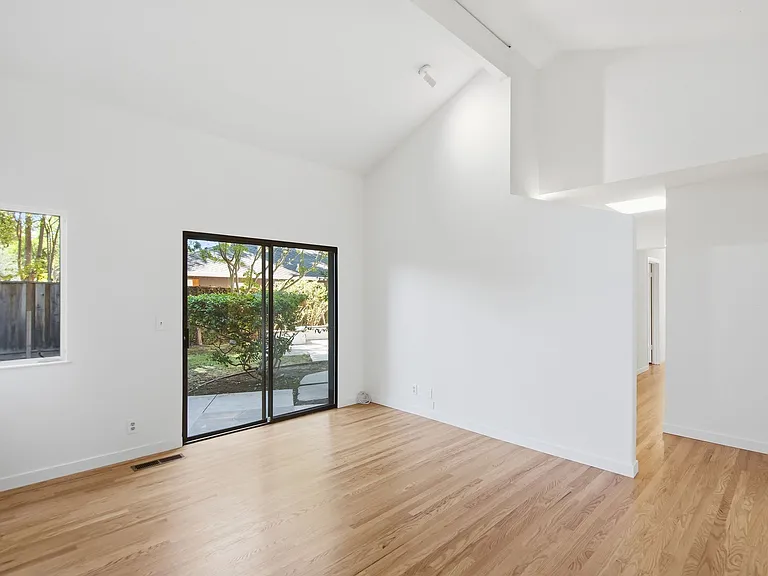 Primary bedroom with direct access to the backyard
