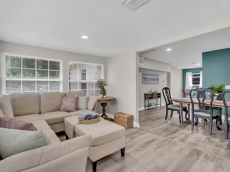 Large living room area with smart TV.