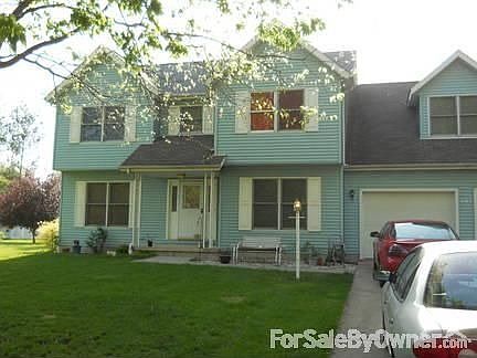 View from School Street.
						:
						Bonus room is above two car garage.