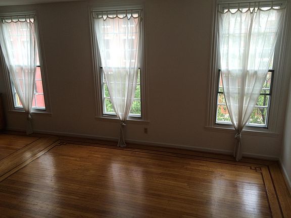 Living room has 3 windows