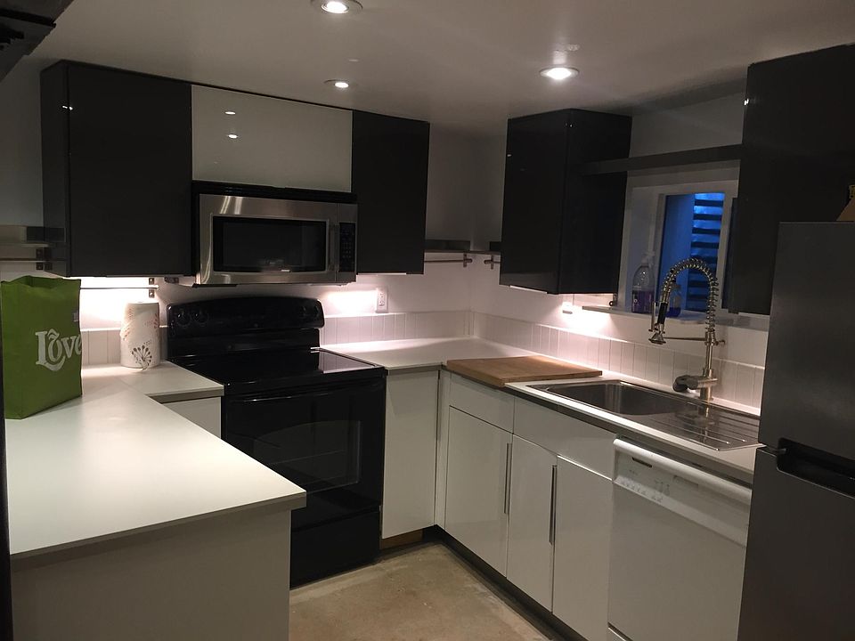 Fully loaded Kitchen with bar facing living room/TV area.