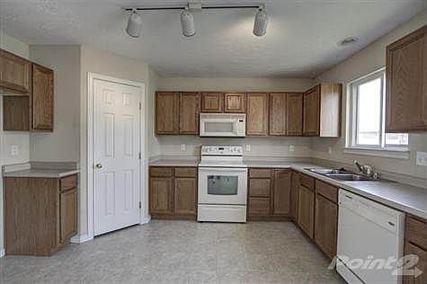 The kitchen offers a dishwasher, microwave and oven/range with plenty of cabinets and counter tops. The pantry offers adequate space for storage. In addition, there is a walkout onto the oversized deck that overlooks the rear flat yard.