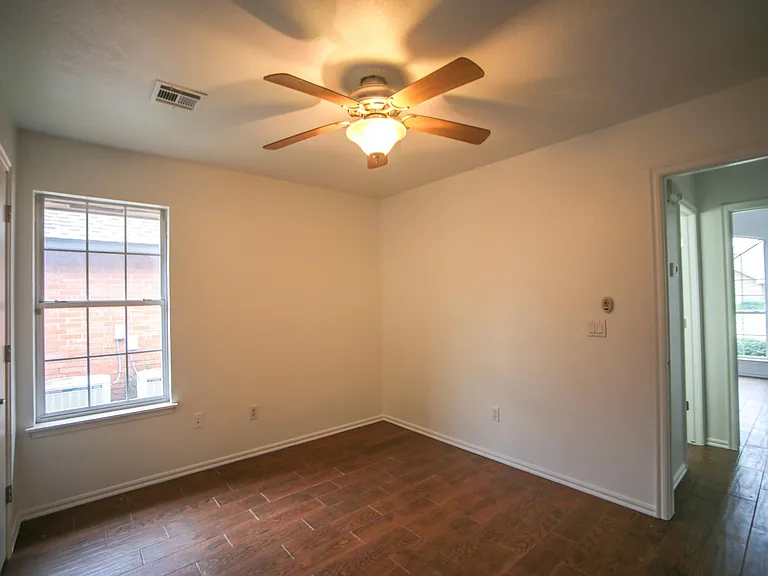Third bedroom with a walk-in closet