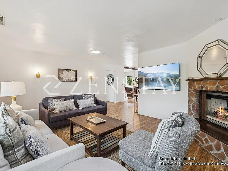 Open Living Room with Gas Fireplace and Smart TV