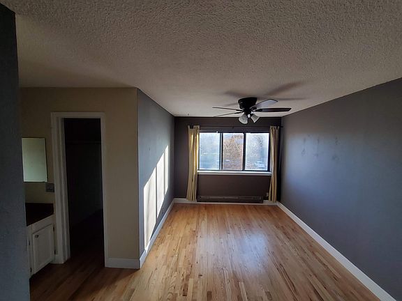 Master bedroom with vanity and walk-in closet.