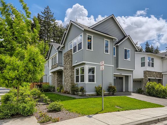 Farmhouse style beautifully lit home on a corner lot