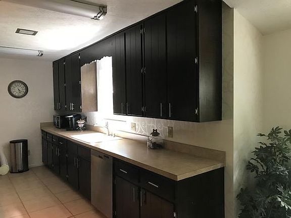 right side of kitchen, sink, bosch dishwasher, lots of cabinet space