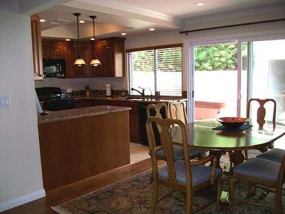 Distressed hardwood floors in dining area