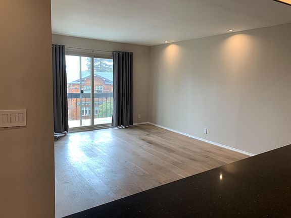 Open concept - this is how we live! Kitchen open to living room and balcony!