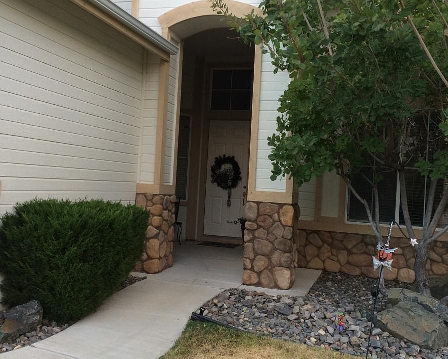 Tranquil Entrance with a porch.