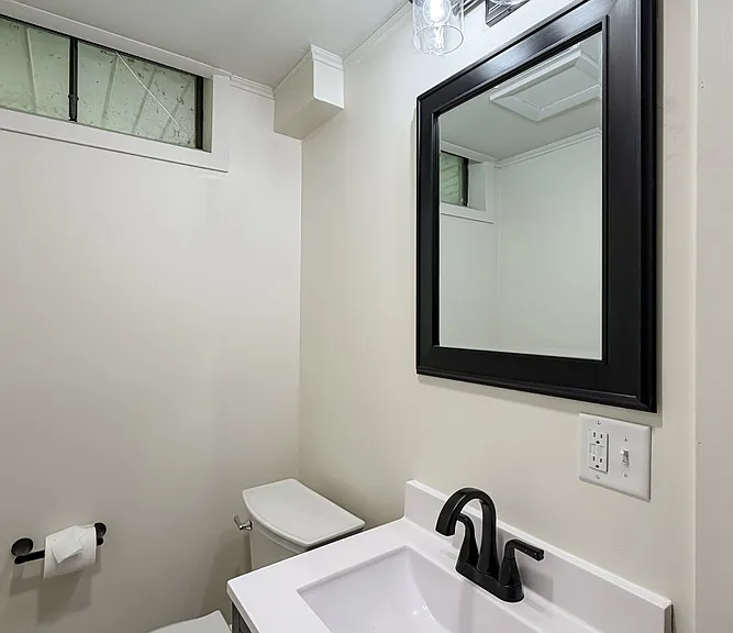 Half Bath in Lower Level off Family Room