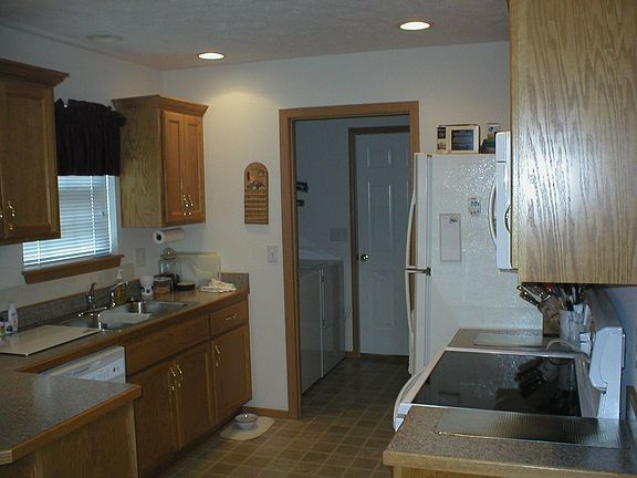 The kitchen appliances were recently updated -- a smooth top range.