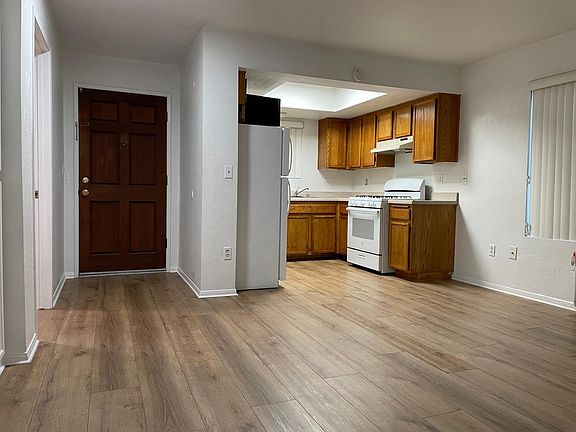View to the kitchen and front door.