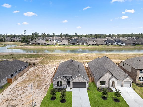 An additional view of your home, lot and neighborhood, including your private backyard with lake vie