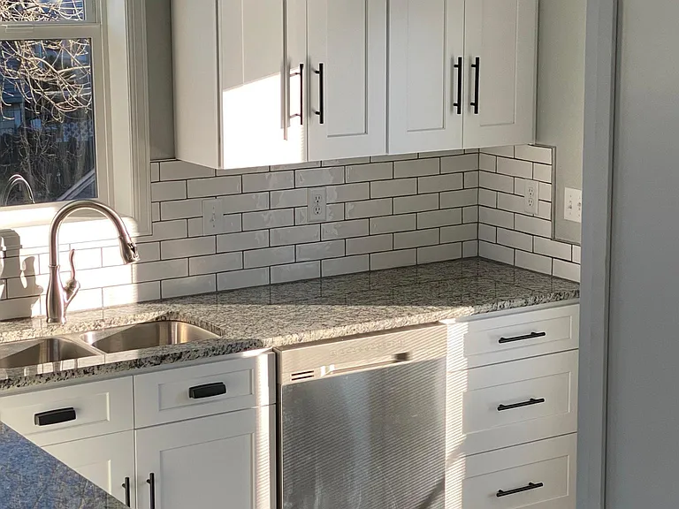 Sleek, modern hardware compliments the cabinetry. There is plenty of storage provided in this apartment, you won't believe how beautiful the design and function play off each other.
