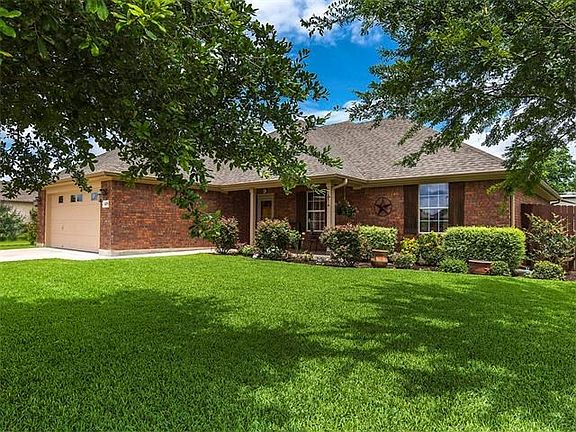 Decorative landscape will illuminate your guests' path as they make their way to your front door. Along the way, they will be able to enjoy the beauty of nature in all of its glory in this magnificent front yard. Parking will never be an issue with your t