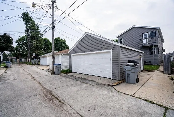 Includes 1 covered garage spot & one uncovered, off-street spot
