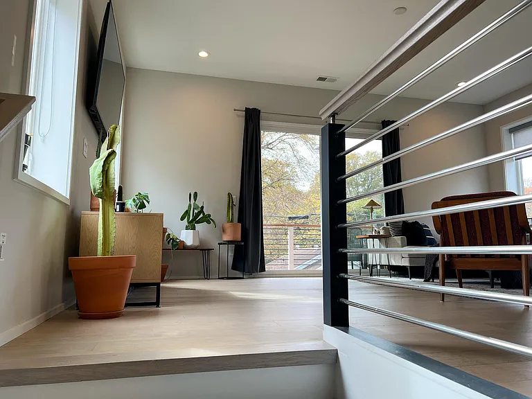 Up the stairs to the living, kitchen, and dining area