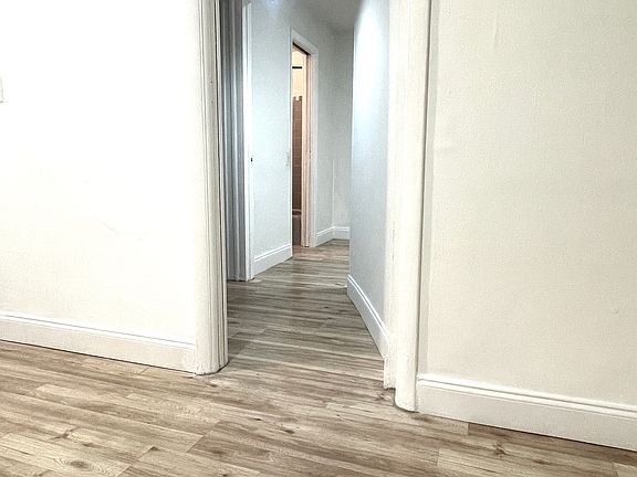 hallway to bedroom and walking closet