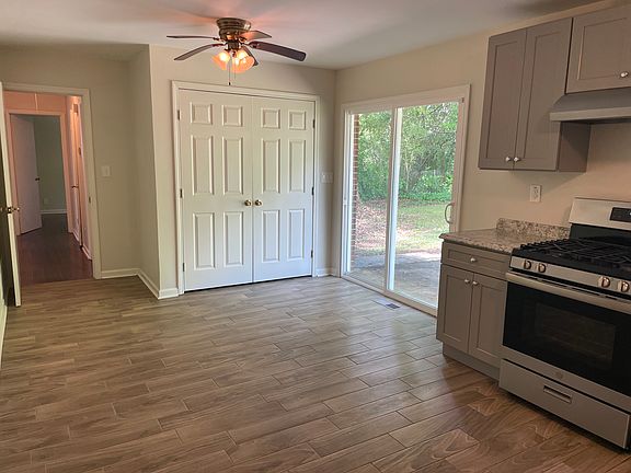The laundry hookups are behind the double doors. This kitchen is BIG. Bring your table and chairs.