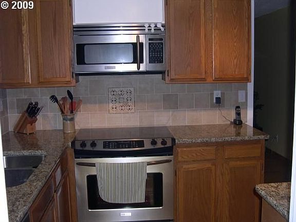 new slab granite & stainless steel appliances