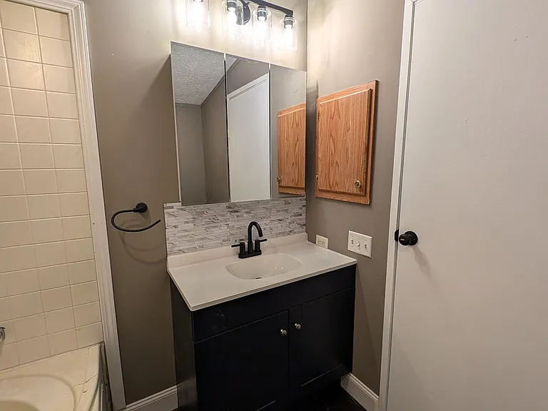 Vanity with medicine cabinet and lighting above