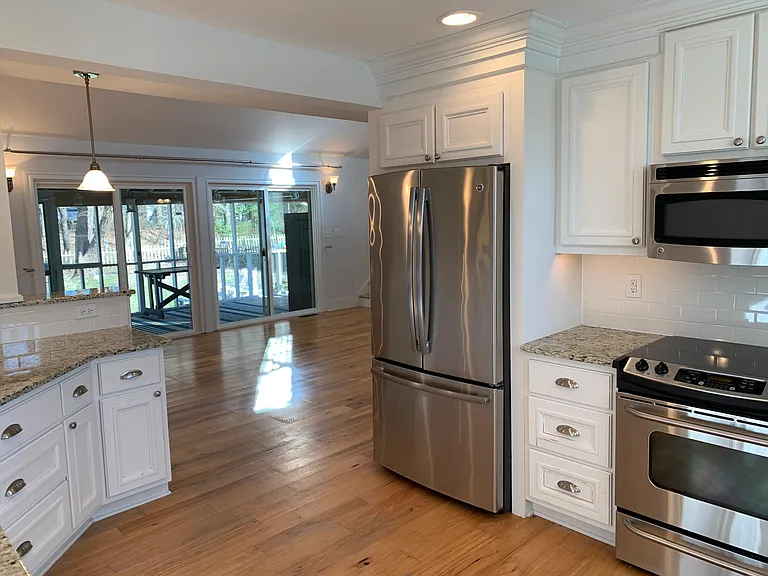 Bright kitchen opens to great room and dining area.