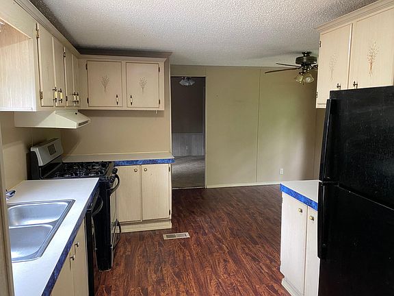 Spacious kitchen with new floors, lots of cabinet space and countertops