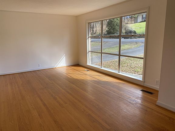 A large picture window brings great light into the living room.
