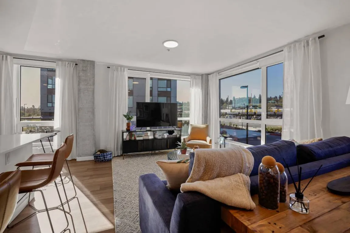 2-Bedroom Model - Living Room with Large Windows and High Ceilings