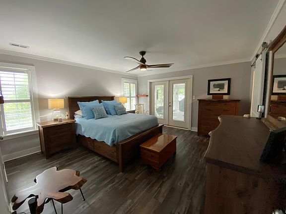 Master suite with beautiful black walnut bedroom furniture.
